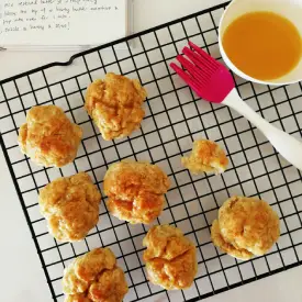 Homemade healthy tater tots with oil on a rack, ready to be baked