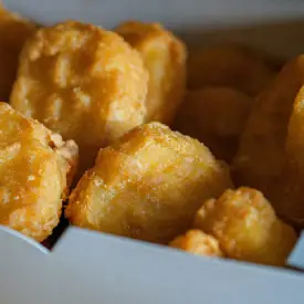 Closer point of view of golden and crispy tater tots